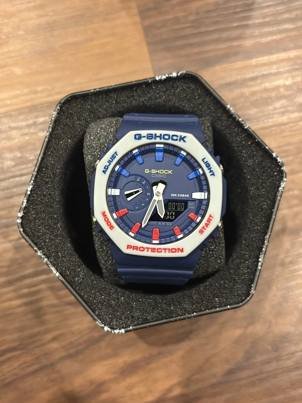 Casio G-Shock Blue Watch with White Bezel and Red Accents